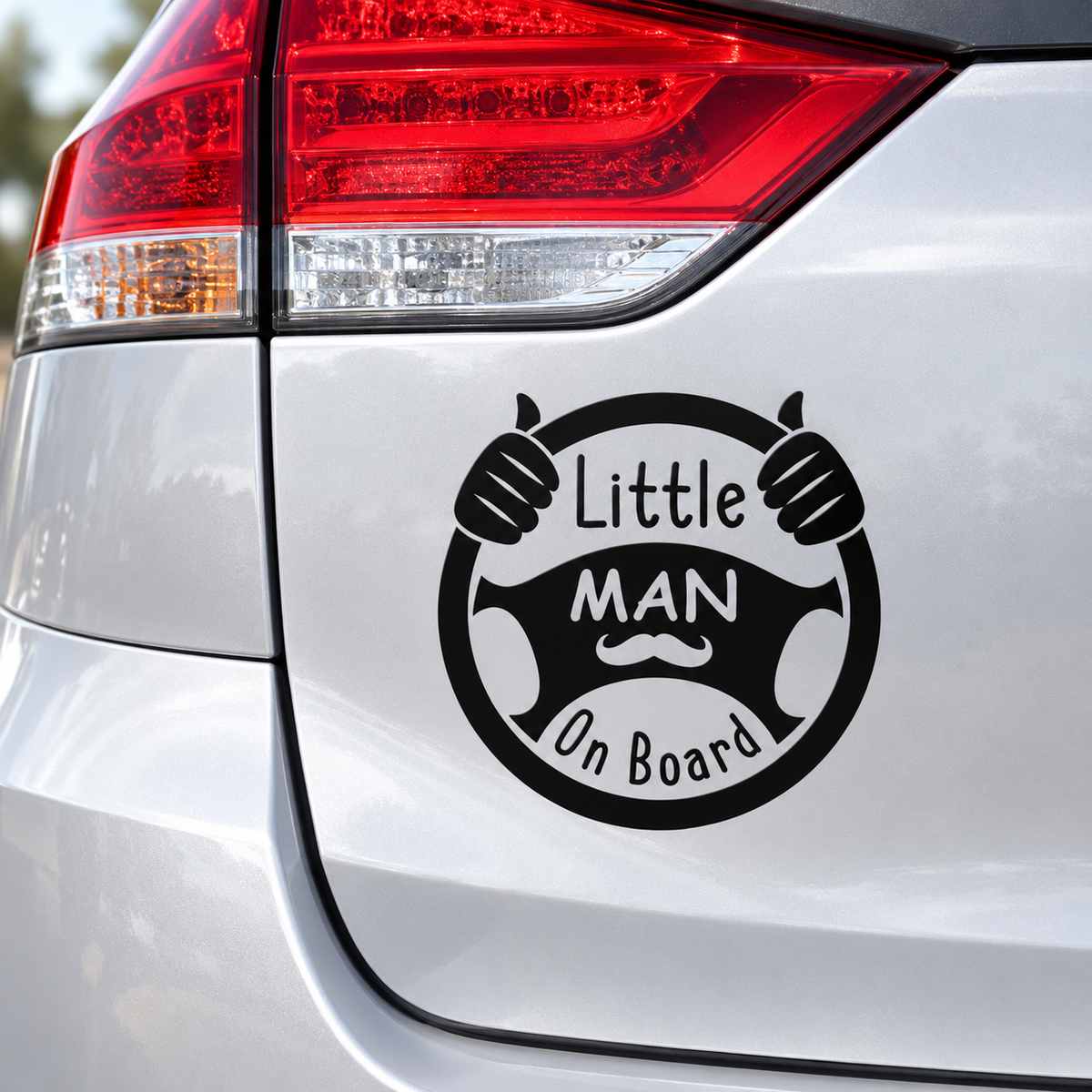 Black Little Man on Board steering wheel transfer decal mockup on silver car